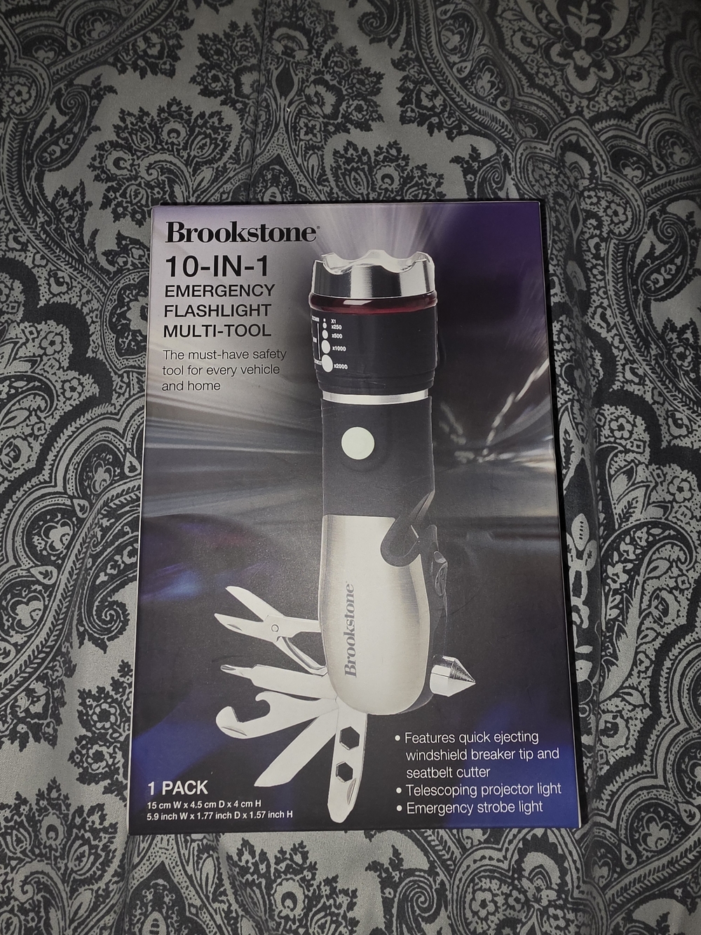 Brookstone Emergency Flashlight Multi-Tool in Black and Silver with Red Accent